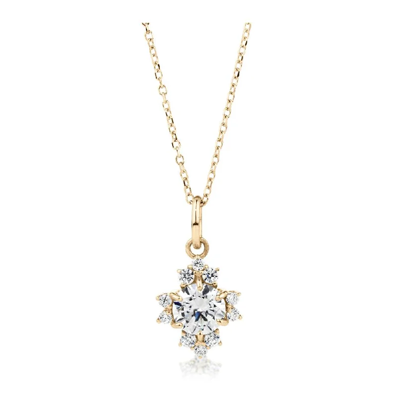 Fancy pendant with 0.78 carats* of diamond simulants in 10 carat yellow gold